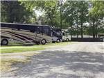 View larger image of A row of luxury motorhomes at BENCHMARK COACH AND RV PARK image #10