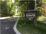 Sign at the tree lined park entrance at UNCOMPAHGRE RIVER ADULT RV PARK - thumbnail