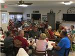 Group of people gathered in the community room at UNCOMPAHGRE RIVER ADULT RV PARK - thumbnail