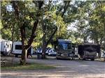 Motorhomes and trailers parked in gravel sites at PARK RIDGE RV CAMPGROUND - thumbnail