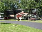 Class A motorhome parked in a RV site at AA ROYAL MOTEL & CAMPGROUND - thumbnail