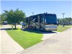 View larger image of A motorhome in a paved pull thru site at A MOTEL  RV PARK image #6