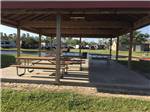 View larger image of The pavilion with picnic benches at A MOTEL  RV PARK image #8