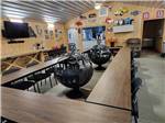 Two large metal sculptures in the middle of tables at BSC OUTDOORS CAMPING & FLOAT TRIPS - thumbnail