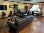 A leather couch and love seat in the main hall at AUBURN GOLD COUNTRY RV PARK - thumbnail