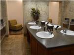 View larger image of Bathroom and shower at CHOCTAW RV PARK - DURANT KOA image #2