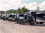ATVs and travel trailers parked in sites at SOUTH FORTY RV PARK - thumbnail