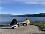 Two people enjoying the bay view - thumbnail