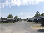 View larger image of The paved road between the RV sites at THE CREEKS GOLF  RV RESORT image #2