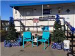 View larger image of A couple of chairs in front of the office at DOWNTOWN RIVERSIDE RV PARK image #7