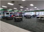The rec hall set up with tables and chairs - thumbnail