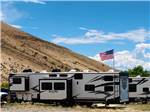 A Nitro travel trailer with a USA flag at THOUSAND TRAILS BLUE MESA RECREATIONAL RANCH - thumbnail