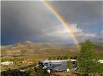A rainbow over the RV sites at THOUSAND TRAILS BLUE MESA RECREATIONAL RANCH - thumbnail