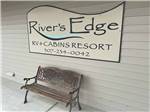 A park bench in front of the office at RIVER'S EDGE RV RESORT - thumbnail
