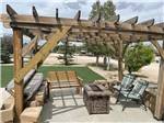 A pergola with a fire pit table at RIVER'S EDGE RV RESORT - thumbnail