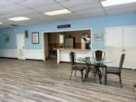 Table and chairs inside the communal room at CARSON VILLAGE MOBILE HOME & RV PARK - thumbnail