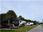 View larger image of A view down the road of parked motorhomes at JOY RV RESORT image #9