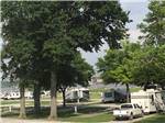 View larger image of Some of the RV sites with trees at RIVER VIEW RV PARK AND RESORT image #8