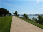 View larger image of A walkway next to the water at RIVER VIEW RV PARK AND RESORT image #9