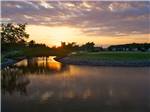 View larger image of View of the river with a walking bridge at WILDWOOD GOLF  RV RESORT image #1