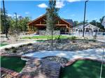 View larger image of Miniature golf course with poolpavilion in distance at OCEAN CITY CAMPGROUND AND BEACH CABINS image #5