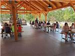 View larger image of People gathered under shaded pavilion at OCEAN CITY CAMPGROUND AND BEACH CABINS image #10