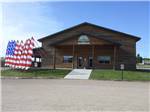 View larger image of American flags outside of the event center at HEARTLAND RV PARK  CABINS image #7