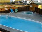 View larger image of The fenced in swimming pool at HEARTLAND RV PARK  CABINS image #9