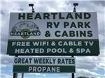 View larger image of The front entrance sign at HEARTLAND RV PARK  CABINS image #12