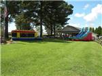 Inflatable jumping house and slide near the pavilion at Tranter's Creek Resort & Campground - thumbnail