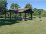 Canopy covering tables in a picnic area at WYLIE PARK CAMPGROUND & STORYBOOK LAND - thumbnail