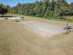 Aerial view of the basketball court and playground at SWAN CREEK COMMUNITY (MHP) - thumbnail