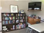 View larger image of The lending library with a TV at NEW LIFE RV PARK image #9