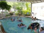 Kids playing in the indoor pool at PECAN PARK RIVERSIDE RV PARK - thumbnail