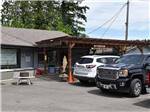 Cars parked in front of one of the buildings at RAINBOW RV RESORT - thumbnail