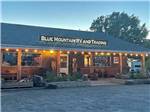 The main building with lights around the roof at BLUE MOUNTAIN RV AND TRADING - thumbnail