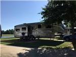 A fifth wheel trailer in a RV site at SHADY PINES RV PARK - thumbnail
