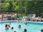 View larger image of People enjoying time in the pool at ARROWHEAD CAMPGROUND image #7