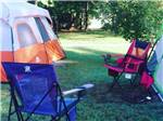 View larger image of A couple of tents and camping chairs at MOUNTAIN PINES CAMPGROUND image #10