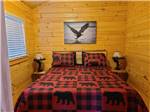 A bed in the rental cabin at MOUNTAIN PINES CAMPGROUND - thumbnail