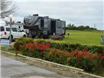 View larger image of A fifth wheel trailer in a RV site at BLUEBONNET RIDGE RV PARK  COTTAGES image #2