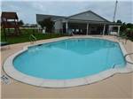 View larger image of The swimming pool area at BLUEBONNET RIDGE RV PARK  COTTAGES image #5