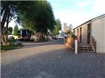 View larger image of The gravel road going by the bathroom building at OSENS RV PARK image #3