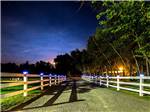 View larger image of Gravel road between wooden fences at OSENS RV PARK image #4