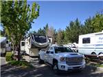View larger image of A fifth wheel trailer and truck in an RV site at JACKS LANDING RV RESORT image #2