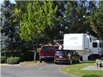 View larger image of A truck and trailer in an RV site at JACKS LANDING RV RESORT image #7