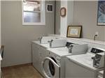 Laundry room with two washers and dryers at NORTH PARK RV CAMPGROUND - thumbnail