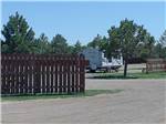 Small travel trailer parked at campsite at NORTH PARK RV CAMPGROUND - thumbnail