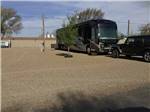 A motorhome in a gravel RV site at CORRAL RV PARK - thumbnail