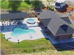 View larger image of An aerial view of the clubhouse and pool at SILVER SPUR RV PARK  RESORT image #7